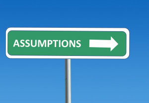 Green sign with blue sky with assumptions written on it