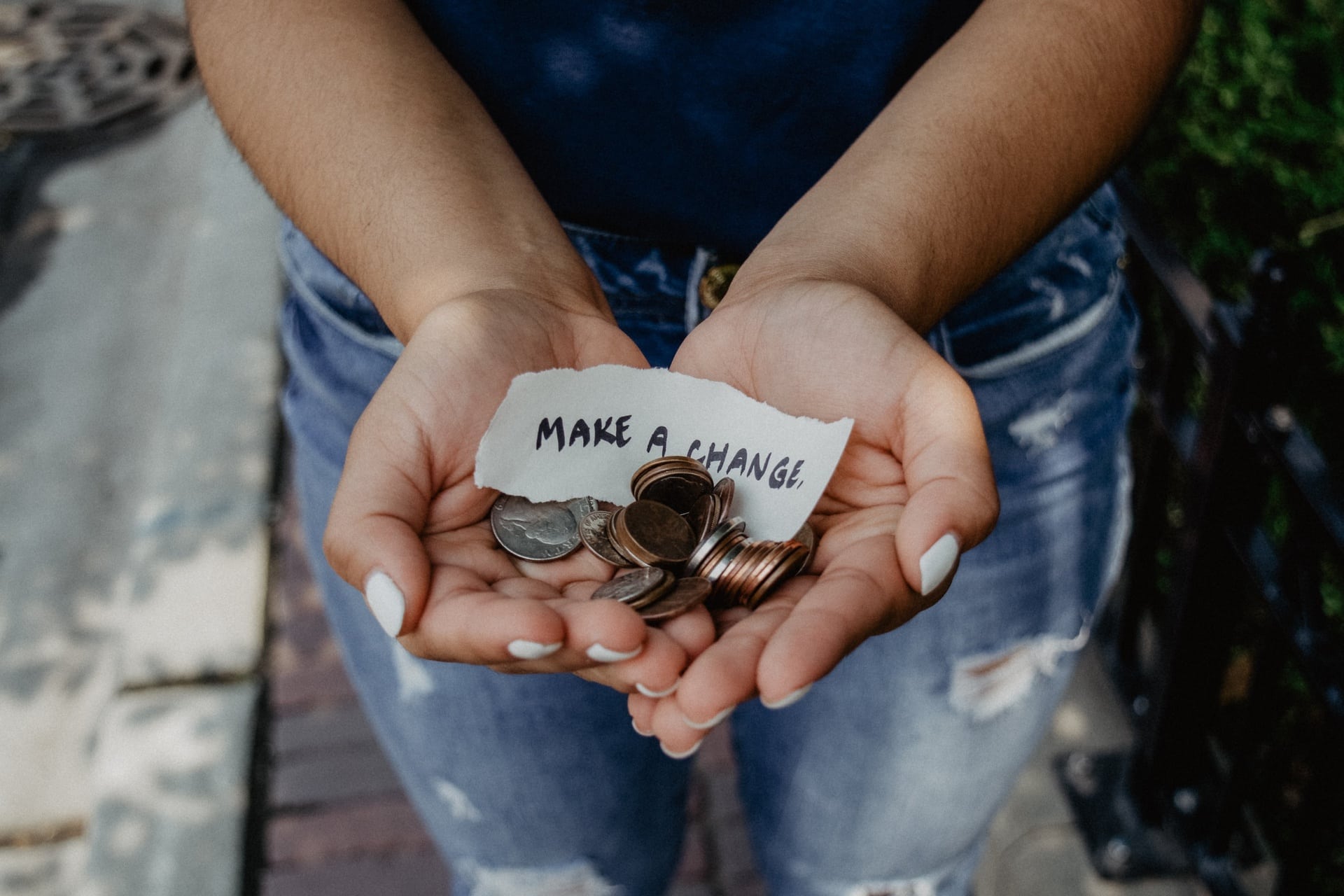Hands holding coins